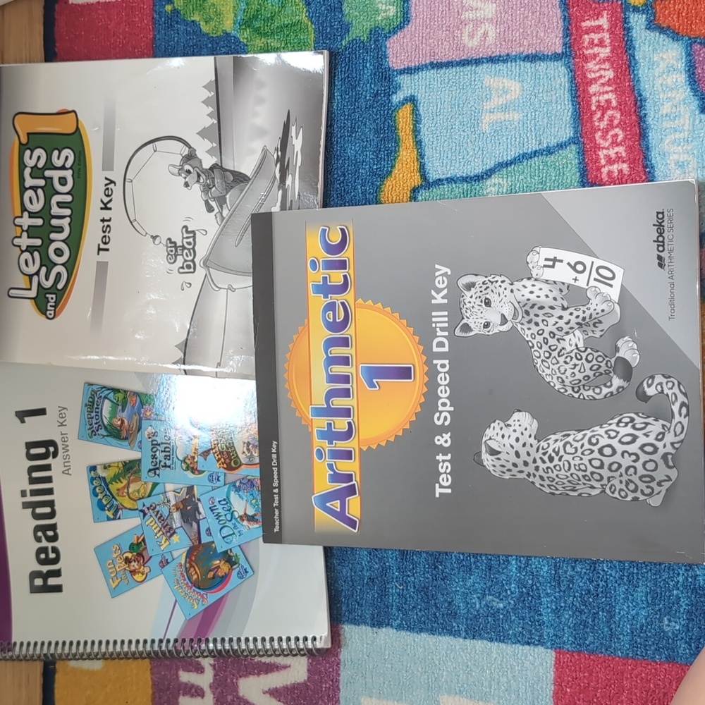 Abeka homeschool test keys for letter and sounds 1, reading 1, and arithmetic 1.